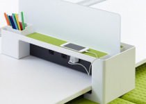 The SOTO launch pad with optional divider screen provides quick connectivity at the side of the worksurface for devices