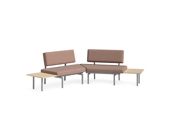 Pink sofa with two small tables